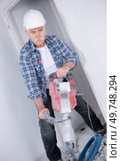 builder worker with pneumatic hammer drill. Стоковое фото, агентство Ingram Publishing / Фотобанк Лори