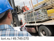 a male worker steel truck delivery. Стоковое фото, агентство Ingram Publishing / Фотобанк Лори
