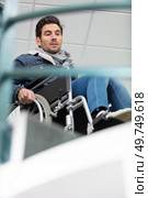 young person in a wheelchair in front of a stair. Стоковое фото, агентство Ingram Publishing / Фотобанк Лори