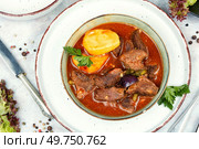 Stewed deer goulash in sauce, venison goulash or deer ragout. Braised venison portion meat. Flat lay.. Roast venison with potatoes. Стоковое фото, агентство Ingram Publishing / Фотобанк Лори