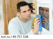 a man doing house work. Стоковое фото, агентство Ingram Publishing / Фотобанк Лори