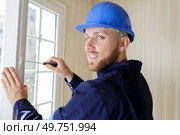 portrait of male window installer at work. Стоковое фото, агентство Ingram Publishing / Фотобанк Лори