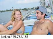 sunbathing on top of the sailboat. Стоковое фото, агентство Ingram Publishing / Фотобанк Лори