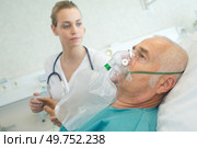 close-up of senior man using oxygen mask in clinic. Стоковое фото, агентство Ingram Publishing / Фотобанк Лори