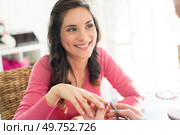 woman having her nails done. Стоковое фото, агентство Ingram Publishing / Фотобанк Лори