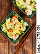 Salad with shrimp, prawns avocado and tomato on old rustic wooden table. Healthy eating, seafood salad.. Salad with prawns and vegetables. Стоковое фото, агентство Ingram Publishing / Фотобанк Лори