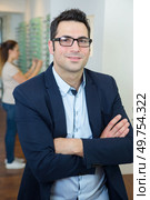 male optometrist looking at camera. Стоковое фото, агентство Ingram Publishing / Фотобанк Лори