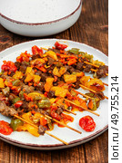 Kebabs or lamb grilled meat skewers, lamb shish kebab on old wooden table. Barbecue.. Traditional Turkish grilled lamb shish kebab or kebap. Стоковое фото, агентство Ingram Publishing / Фотобанк Лори