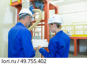 factory engineer studying the plan. Стоковое фото, агентство Ingram Publishing / Фотобанк Лори