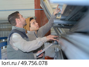 workers with clipboard checking stock of pvc pipes. Стоковое фото, агентство Ingram Publishing / Фотобанк Лори