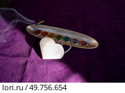 seven chakras signs and stone heart with flower of life pattern. seven chakras stones, energy healing concept. Стоковое фото, агентство Ingram Publishing / Фотобанк Лори