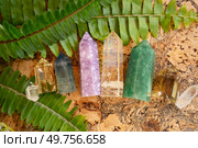 Gemstones minerals stones in the shape of obelisks. Witchcraft, herbal medicine and healing, Magic healing Rock for Reiki Crystal Ritual, Witchcraft, spiritual esoteric practice.. Healing crystals on brown background. Стоковое фото, агентство Ingram Publishing / Фотобанк Лори