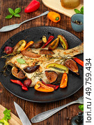 Roasted flounder fish, flatfish on rustic wooden table. Rustic style. Fried flounder fish. Стоковое фото, агентство Ingram Publishing / Фотобанк Лори