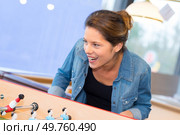 female playing table football. Стоковое фото, агентство Ingram Publishing / Фотобанк Лори