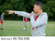 referee with whistle at soccer game. Стоковое фото, агентство Ingram Publishing / Фотобанк Лори