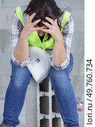 young female engineer suffering headache. Стоковое фото, агентство Ingram Publishing / Фотобанк Лори