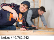 young woman worker in the carpenter workroom. Стоковое фото, агентство Ingram Publishing / Фотобанк Лори