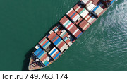 Cargo ship filled with containers in port area. Стоковое фото, фотограф Михаил Коханчиков / Фотобанк Лори