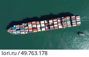 Cargo ship filled with containers in port area. Стоковое фото, фотограф Михаил Коханчиков / Фотобанк Лори