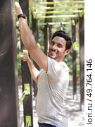 sporty man enjoying music during workout outdoors. Стоковое фото, агентство Ingram Publishing / Фотобанк Лори