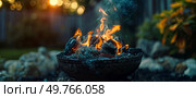 Close-up of a fiery blaze raging inside a bowl, emitting flames and heat.. Intense Fire Burning in Bowl. Стоковое фото, агентство Ingram Publishing / Фотобанк Лори