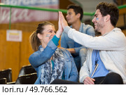 couple of supporters high fiving each other. Стоковое фото, агентство Ingram Publishing / Фотобанк Лори