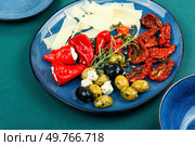 Mediterranean snack assortment. Assortment of antipasti on a plate.. A set of food. Стоковое фото, агентство Ingram Publishing / Фотобанк Лори