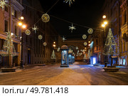 Saint Petersburg, Russia, 12.18.2021: Bolshaya Morskaya Street in New Year's illumination. Редакционное фото, фотограф Ula Ulachka / Фотобанк Лори
