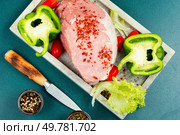 Spices on sliced raw pork meat, assorted raw meats for barbecuing. Top view.. A photo of raw pork on the table. Стоковое фото, агентство Ingram Publishing / Фотобанк Лори
