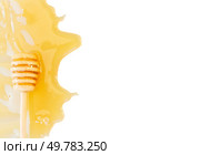 dripping honey and honey dipper border isolated on white background. dripping honey border. Стоковое фото, агентство Ingram Publishing / Фотобанк Лори