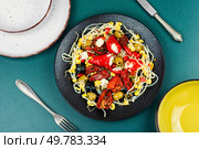 A delicious salad of pickled soybean sprouts, dried tomatoes, olives and peppers. Chinese food.. Vegan Salad of Pickled Vegetables and Soybeans. Стоковое фото, агентство Ingram Publishing / Фотобанк Лори