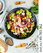 Fresh and healthy octopus salad with potatoes. Traditional Italian food. Top view.. Octopus salad, Traditional Portuguese cuisine. Стоковое фото, агентство Ingram Publishing / Фотобанк Лори