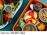 Aromatic set of spices, many seasonings and herbs. Spices herbs seasoning condiments. Flat lay, close up.. Different aromatic spices. Стоковое фото, агентство Ingram Publishing / Фотобанк Лори