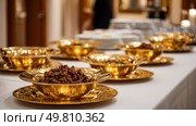 Junk food served in golden plates at a luxury banquet. Symbol of a major environmental problem caused by urban overconsumption waste. Abstract image. Стоковое AI-изображение, AI-художник ALLA YURTAYEVA / Фотобанк Лори