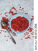 Goji berries, wolfberry bowl. Dried goji berries in bowl on table. Superfood. Dried goji berry preparations herbal medicine ingredients.. Dried goji berries, healthy diet. Стоковое фото, агентство Ingram Publishing / Фотобанк Лори