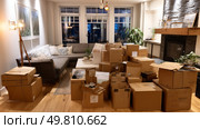 A living room turned warehouse full of online orders. Symbol of a major environmental problem caused by urban overconsumption waste. Abstract image. Стоковое AI-изображение, AI-художник ALLA YURTAYEVA / Фотобанк Лори