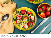 Plate of fresh salad fruit with asparagus, strawberries and broccoli. Food photography. Top view.. Asparagus Salad with Strawberries. Стоковое фото, агентство Ingram Publishing / Фотобанк Лори