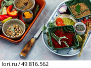 Cooking and seasoning spices, various spices on table. Bowls with various spices.. Various spices, herbs and condiments. Стоковое фото, агентство Ingram Publishing / Фотобанк Лори