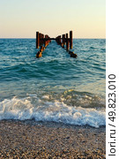ruined old jetty in sunset light. Coastline. Стоковое фото, агентство Ingram Publishing / Фотобанк Лори