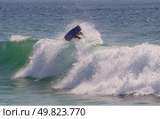 Body boarder riding a big wave. Стоковое фото, агентство Ingram Publishing / Фотобанк Лори