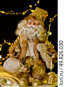 Santa Claus Doll on dark background. Стоковое фото, агентство Ingram Publishing / Фотобанк Лори