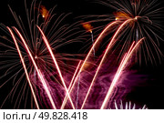 Firework streaks in the night sky during celebrations. Стоковое фото, агентство Ingram Publishing / Фотобанк Лори