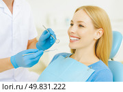 Positive female client tilts head comfortably during follow-up illustrating trustful relationship strong preventive program inside contemporary dental facility. Стоковое AI-изображение, AI-художник Павел Муравьев / Фотобанк Лори
