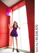 attractive girl with balloons near window. doll. Стоковое фото, агентство Ingram Publishing / Фотобанк Лори