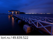 pavillion at end of wooden jetty walkway at dusk. Стоковое фото, агентство Ingram Publishing / Фотобанк Лори