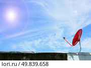 isolated red satellite on sunny blue sky. Стоковое фото, агентство Ingram Publishing / Фотобанк Лори