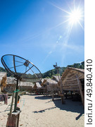 Big telecommunication satellite dish over sunny sky. Стоковое фото, агентство Ingram Publishing / Фотобанк Лори