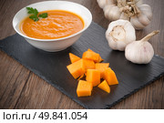 Pumpkin soup on white wood background. Стоковое фото, агентство Ingram Publishing / Фотобанк Лори