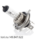 A halogen car headlamp bulb with main and dipped beams. Стоковое фото, агентство Ingram Publishing / Фотобанк Лори