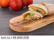 Tortillas with chicken and vegetables, on chalk board table. Стоковое фото, агентство Ingram Publishing / Фотобанк Лори